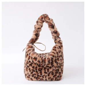 Close-up of leopard print faux fur tote bag with a stylish scrunchie handle design