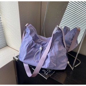 Minimalist light purple crescent shoulder bag with drawstring pleats and nylon fabric