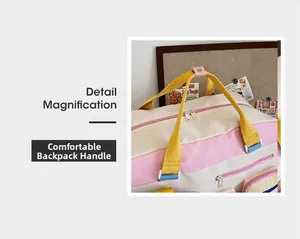 Detailansicht der pink-beigen Nylontasche mit verstärkten gelben Tragegriffen und Druckknopf