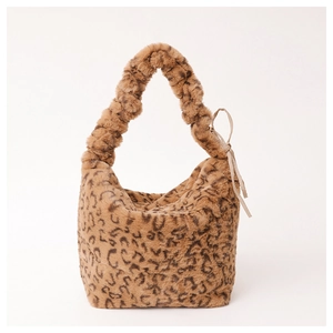 Detail of leopard print faux fur hobo bag with ruched shoulder strap and soft texture