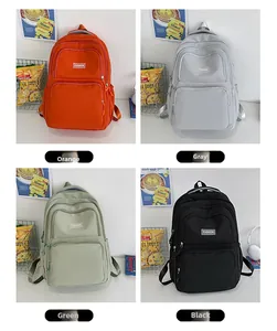 Detail view of nylon backpack styles in orange, gray, green and black color options
