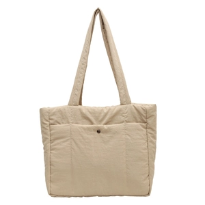 Minimalist beige quilted puffy tote bag with front pocket and double shoulder straps