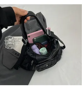 Detailed view of spacious black PU leather tote bag interior showing large storage capacity