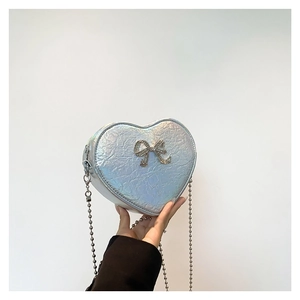 Iridescent heart shaped crossbody bag with pleated metallic finish and bow