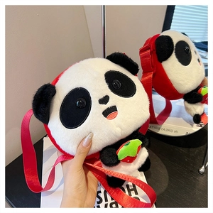 Close-up of a panda-shaped plush crossbody bag with red straps and green strawberry detail