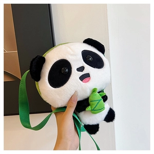 Detailed close-up of plush panda crossbody bag with soft faux fur and green bamboo accent