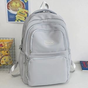 Minimalist light blue nylon backpack with multi-layer zipper pockets for daily school use