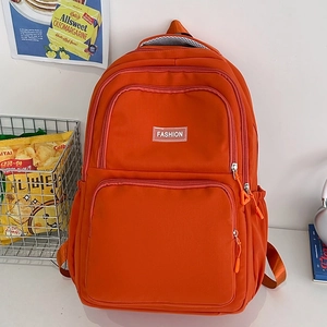 Vibrant orange nylon backpack with multi-compartment design for daily commuting