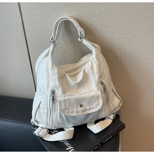 White soft PU leather tote bag with multi-pocket design and adjustable silver straps