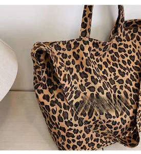 Close-up detail of durable leopard print canvas tote bag with large storage capacity