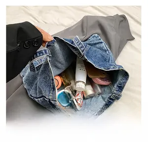 Detail view of large denim tote bag interior showing spacious capacity for daily essentials