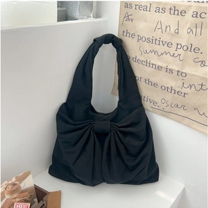Sac à main chic en denim noir avec grand nœud pour un usage quotidien estival
