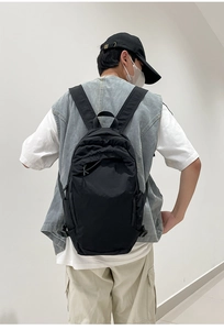 Detailed view of the black washed fabric backpack with natural wrinkled texture