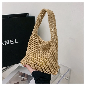 Detail of handmade crochet mesh tote bag with inner lining and thick rope texture