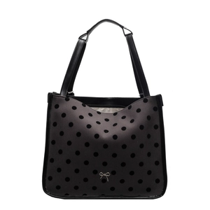 Dark grey fabric tote bag with black polka dots, leather handles and a silver metal bow