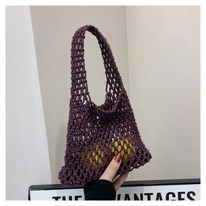 Detailed close-up of a purple woven mesh bag made of high-quality cotton rope
