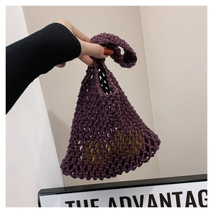 Macro detail of purple woven crochet tote bag with contrast yellow interior lining