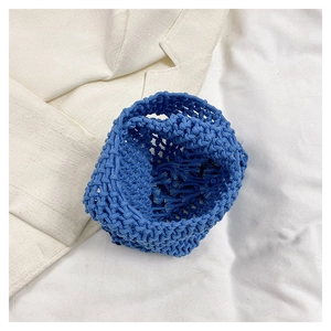 Detailed macro view of vibrant blue hand-woven texture and thick cotton rope pattern