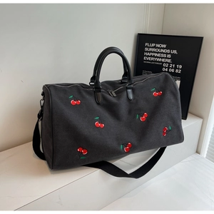Large black fabric tote bag with red cherry embroidery and dual leather handles