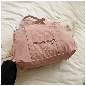 Pink waterproof nylon tote bag with Vella embroidery for travel and fitness