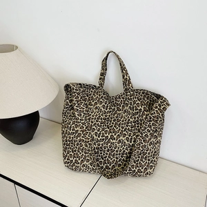 Minimalist leopard print canvas tote bag with wide handles and spacious interior