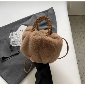 Brown plush faux fur crossbody handbag with woven leather handle for women