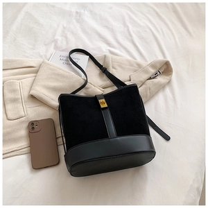 Fashionable black faux suede bucket bag with gold clasp and adjustable strap for women