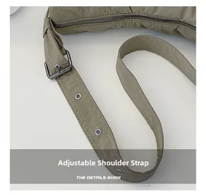 Detail of adjustable nylon shoulder strap with metallic eyelets and sturdy buckles