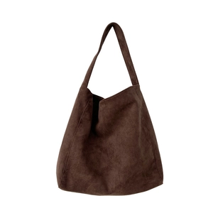 Deep brown suede tote bag for women with minimalist hobo silhouette and spacious shoulder strap