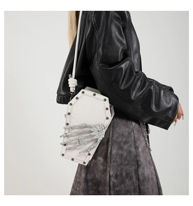 Gothic white coffin crossbody bag featuring a 3D skeleton hand detail and black studs
