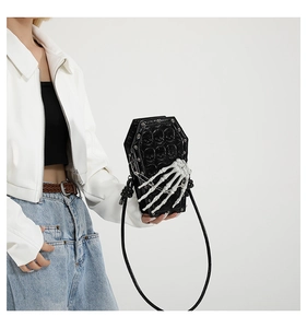 Gothic coffin shaped black PU shoulder bag with 3D skull embossing and skeletal hand detail