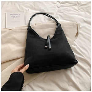 Minimalist black PU and suede crescent hobo bag with sleek metal beads and tie detail