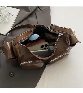 Interior view of large capacity brown PU crossbody bag showing storage for daily essentials