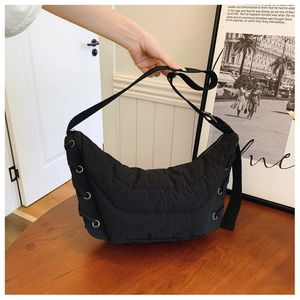Chic black quilted nylon crescent shoulder bag with drawstring detail for women