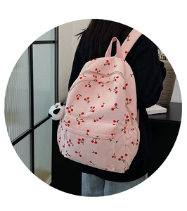 Sac à dos rose à imprimé cerise avec texture verticale et joli porte-clés panda peluche