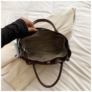 Top view of deep coffee PU tote bag showing interior lining and silver metal hardware