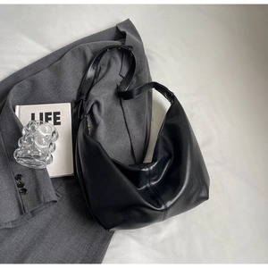 Minimalist black PU leather hobo shoulder bag with matte finish and gold buckle