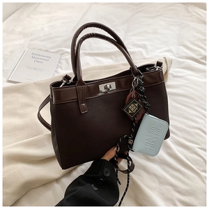 Minimalist dark brown PU leather tote bag with silver twist lock and decorative charms