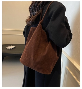 Detailed side view of the deep brown matte PU leather tote bag with a minimalist design