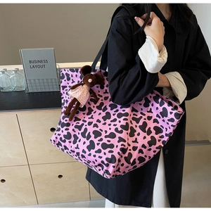 Pink canvas tote bag with black animal print and cute plush mouse keychain accessory