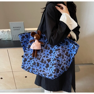 Blue tote bag with black animal print and cute mouse doll charm for daily casual wear