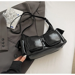Minimalist black glossy PU leather shoulder bag with functional multi-pocket design for women