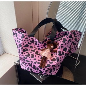 Pink and black cow print tote bag for women with cute rabbit plush charm