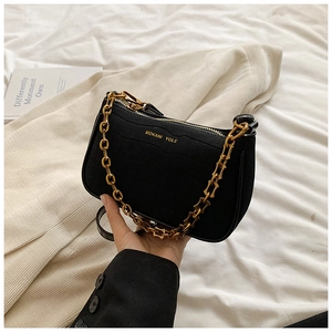 Minimalist black PU leather underarm bag with decorative gold chain strap and zipper