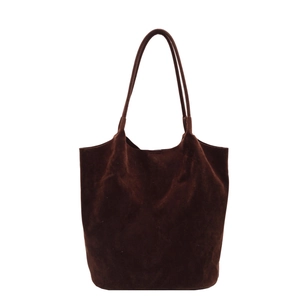 Minimalist deep brown faux suede tote bag with slim shoulder straps on white background