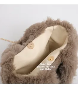 Detail view of the brown plush bag featuring a durable gold magnetic metal clasp closure