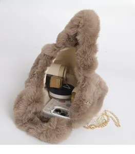 Detail showing plush brown faux fur bag interior with ample space for cosmetics