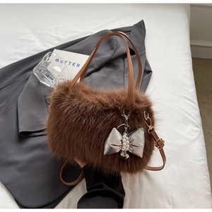 Brown fluffy faux fur crossbody handbag with silver bow and pearl heart charm accessory