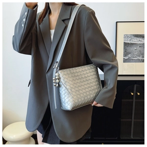 Detail of silver woven PU leather shoulder bag with metallic beads and pearl charms