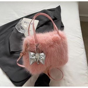 Pink plush faux fur crossbody handbag with silver bow pearl charm and leather straps